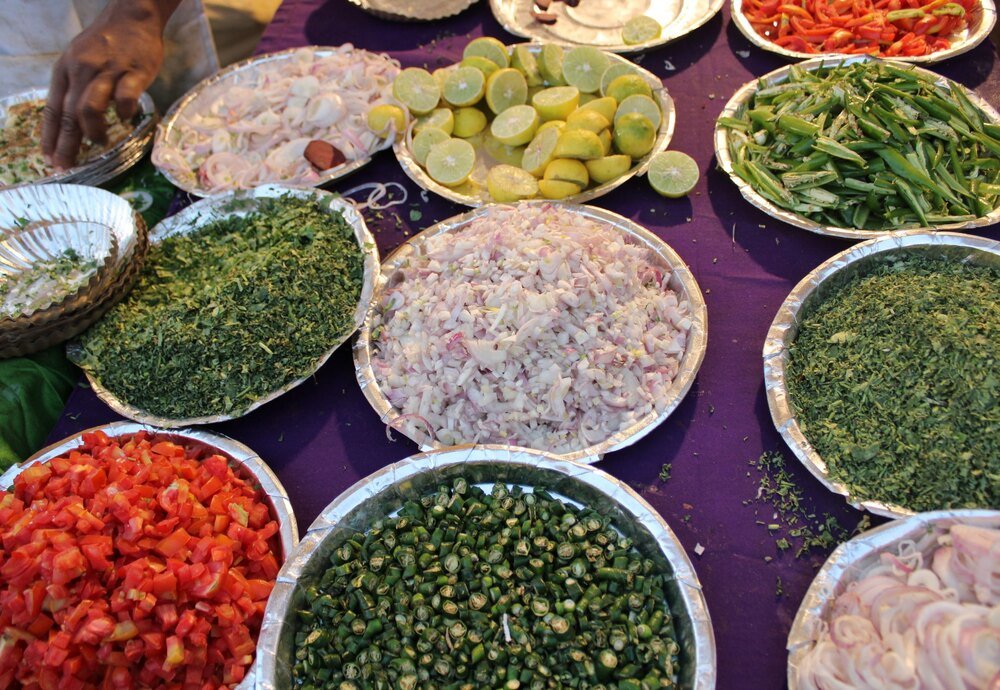 Chopped vegetables and greens ready for Indian cooking